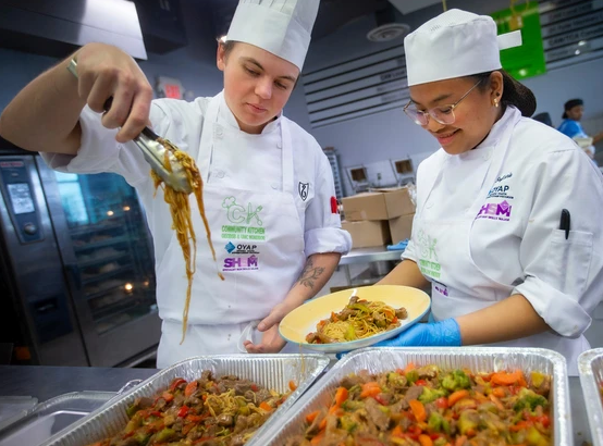Community Kitchen students serving food