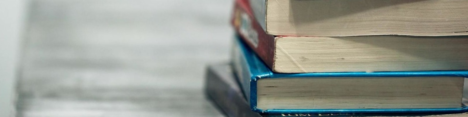 Textbooks stacked on a table