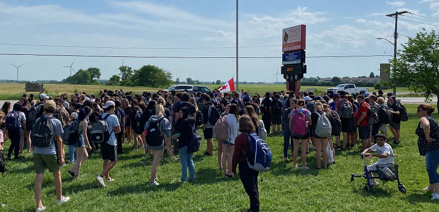 Pride flag raising crowd