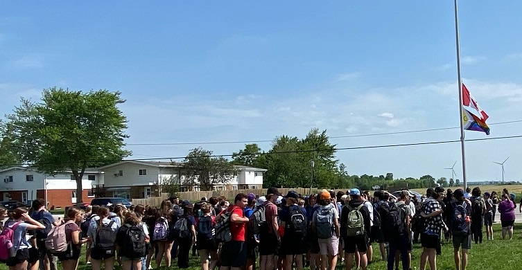 Pride flag being raised