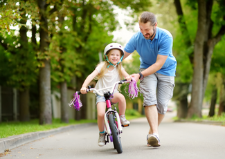 Father and daughter bike riding