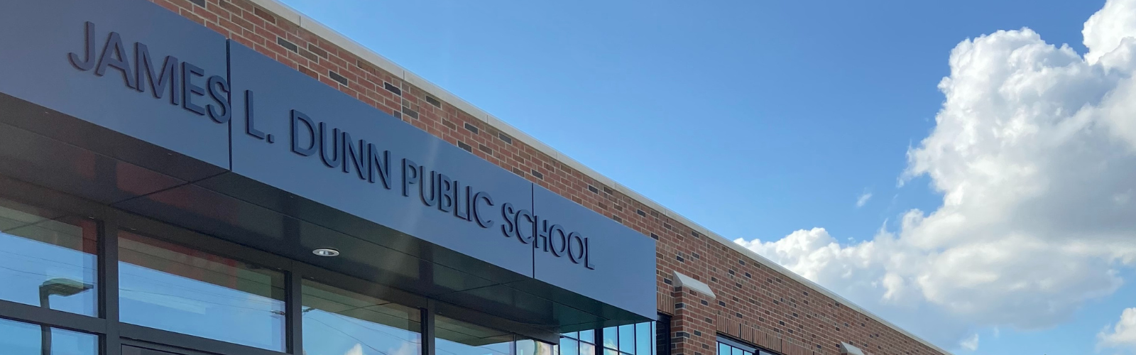 An exterior shot of the school sign at the front of James L. Dunn Public School
