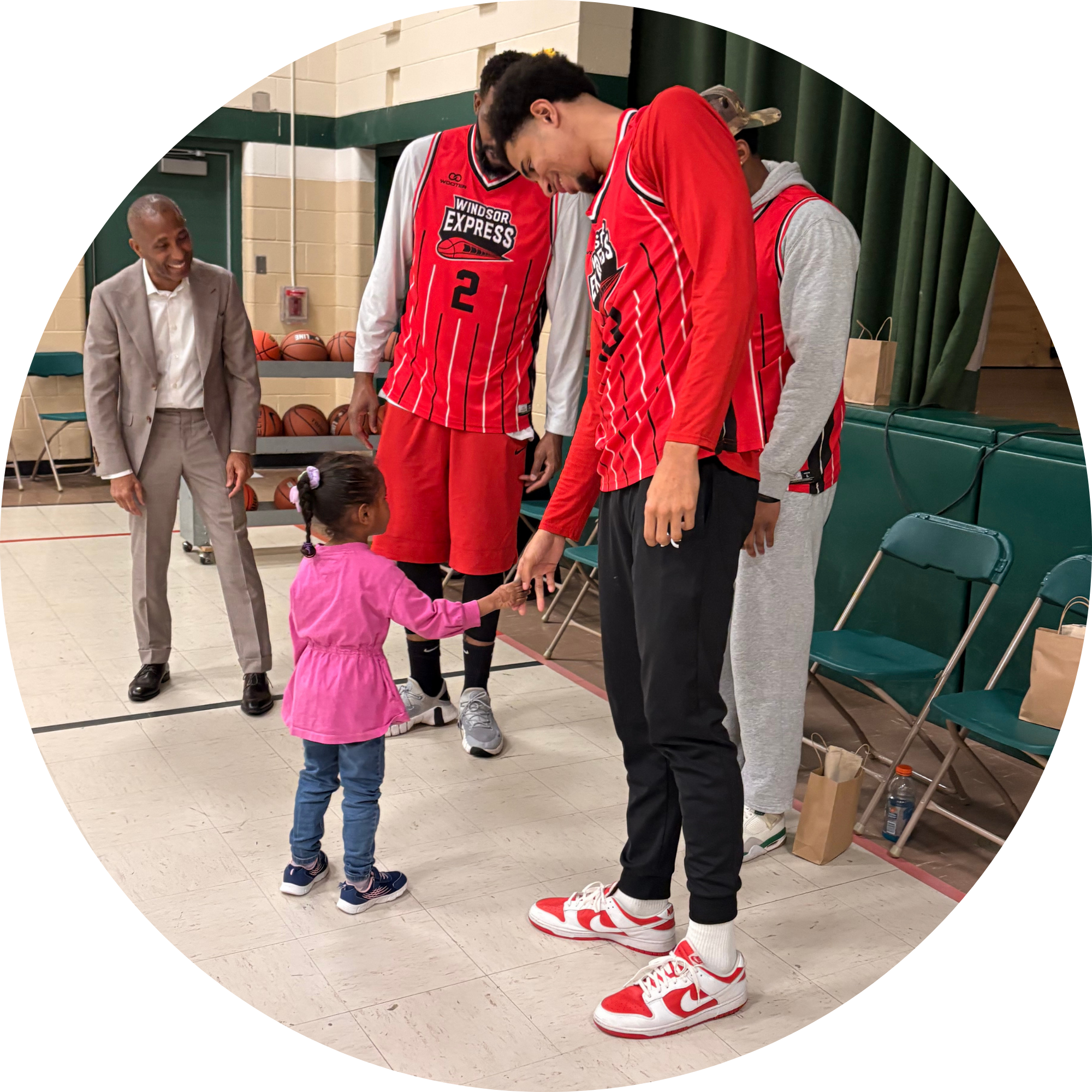 Baskteball players and a student at the GBC Event