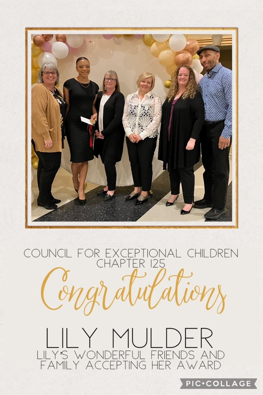Image of Lily Muddler Family accepting award