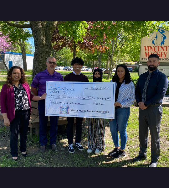 Massey students and administration presenting a donation to the Windsor Downtown Mission