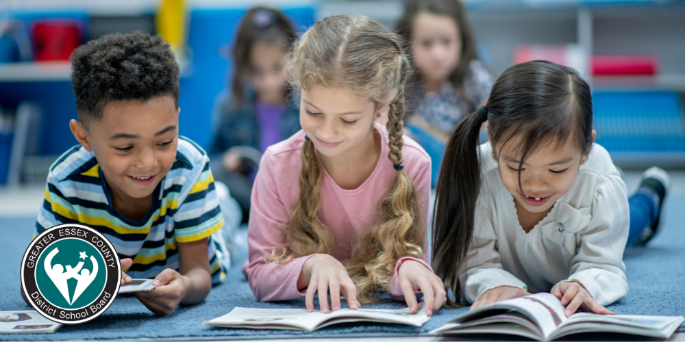 Three children reading books