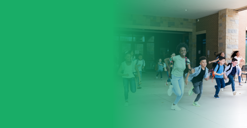 Chidren running out of the building on the last day of school
