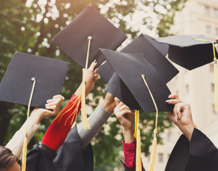 Students throwing graduation caps
